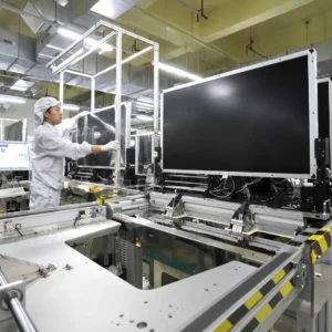 Two industrial LCD revisions being reviewed against engineering change documentation and a validation checklist